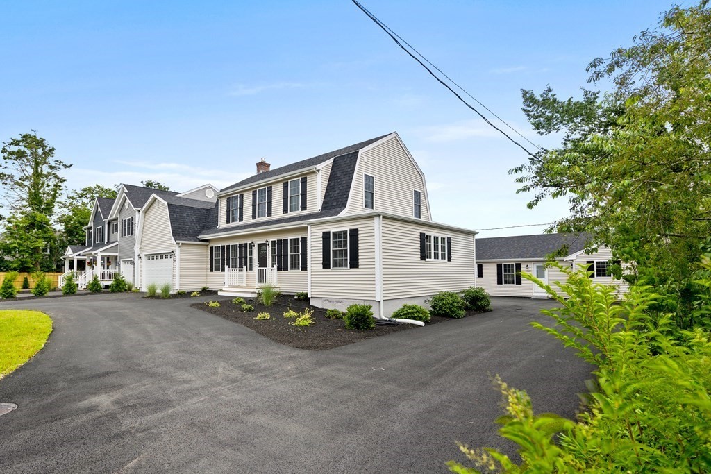 108 High Street Wareham, MA 02571 - Photo 2 of 40 a view of a house with a garden and pathway