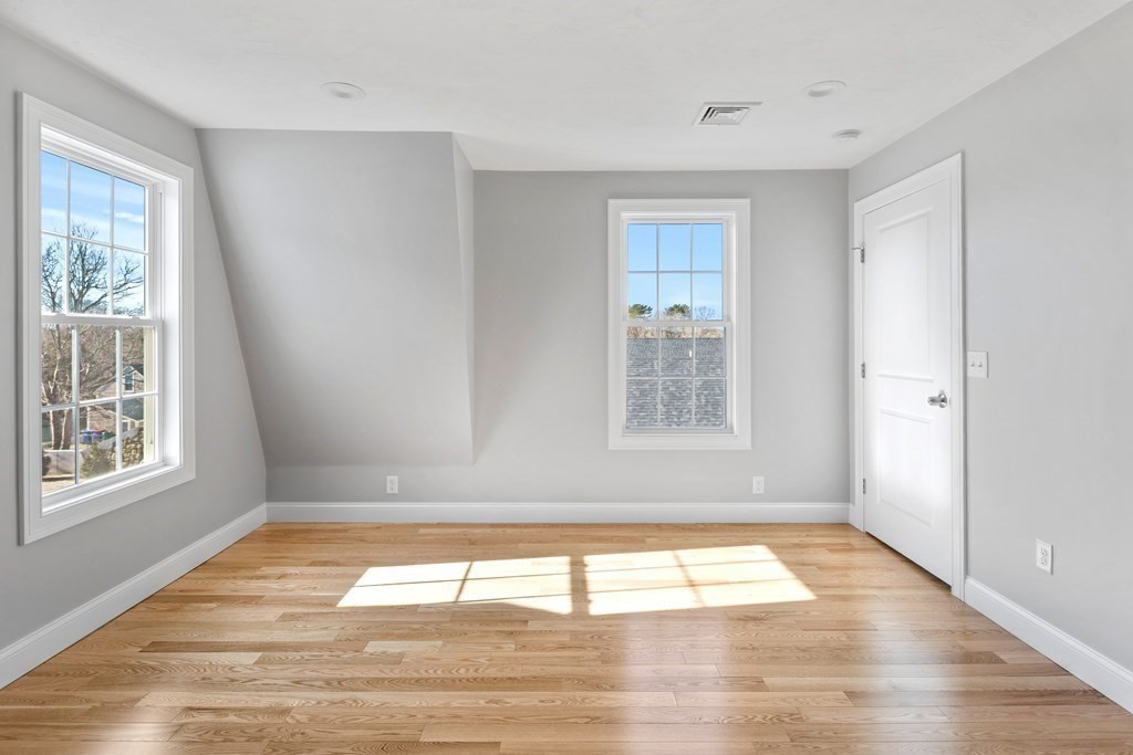 108 High Street Wareham, MA 02571 - Photo 22 of 40 a view of empty room with wooden floor and fan
