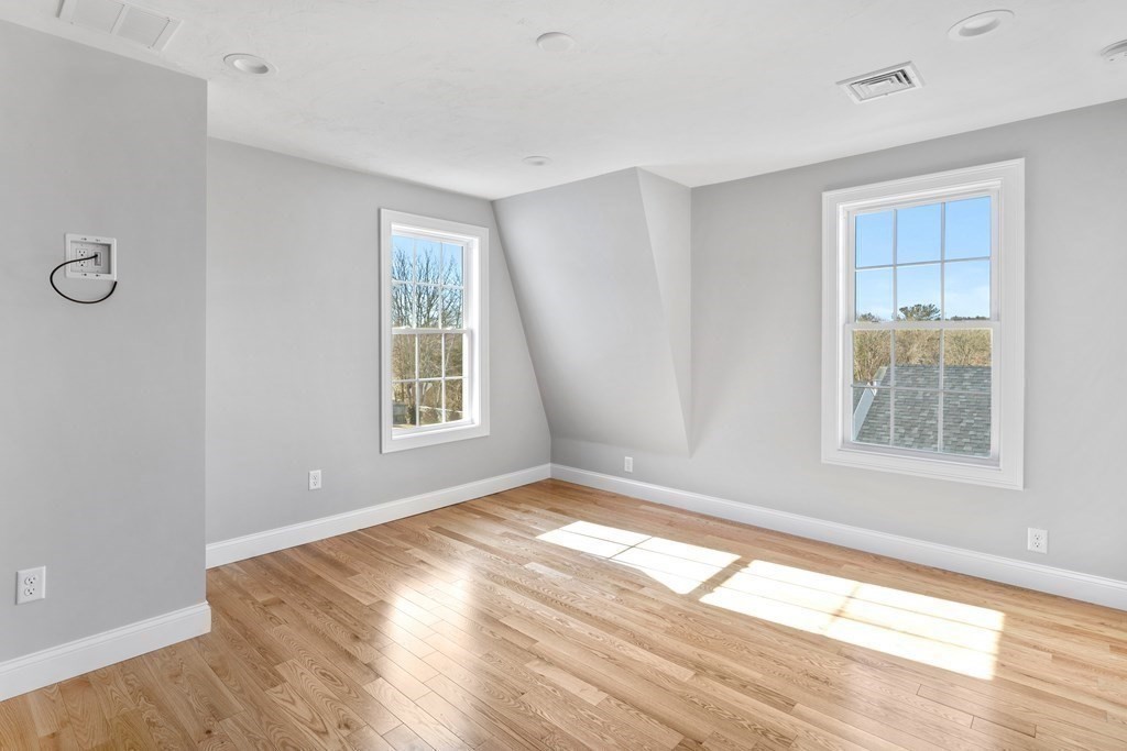 108 High Street Wareham, MA 02571 - Photo 23 of 40 a view of an empty room with wooden floor and a window