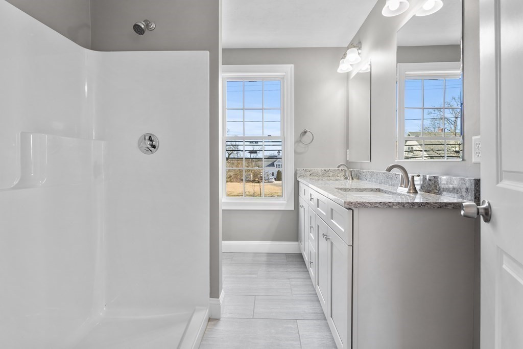 108 High Street Wareham, MA 02571 - Photo 26 of 40 a bathroom with a double vanity sink a vanity and a mirror