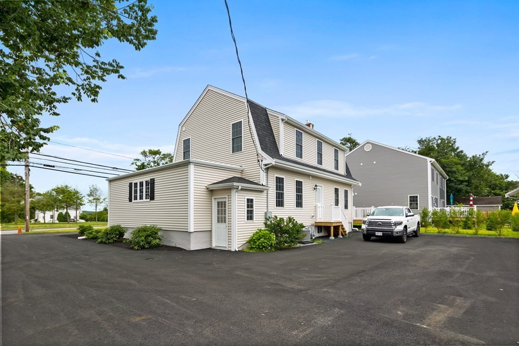 108 High Street Wareham, MA 02571 - Photo 5 of 40 a front view of a house with a street