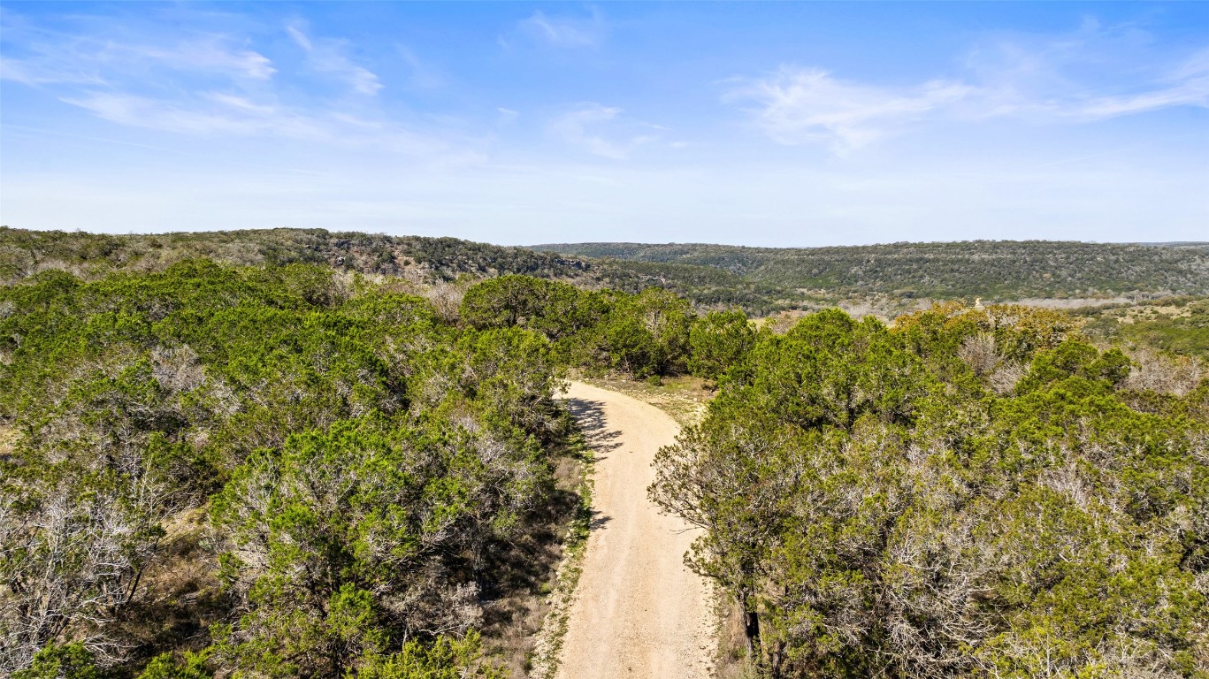 Tbd Bluff End Road New Braunfels, TX 78132 - Photo 8 of 18 Drone / aerial view featuring a wooded view