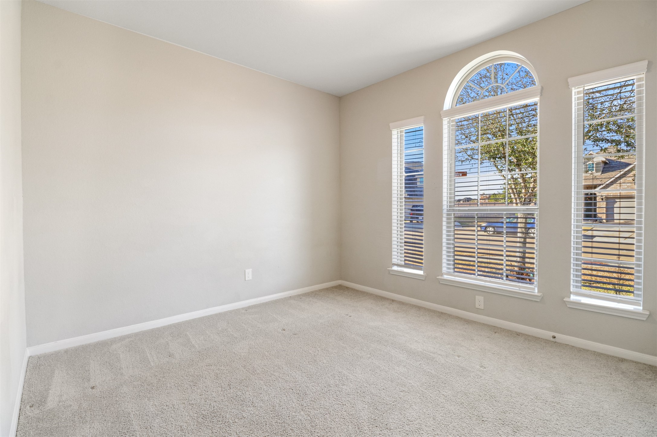 6010 Mapleton Meadow Lane Richmond, TX 77407 - Photo 18 of 34 a view of an empty room with a window