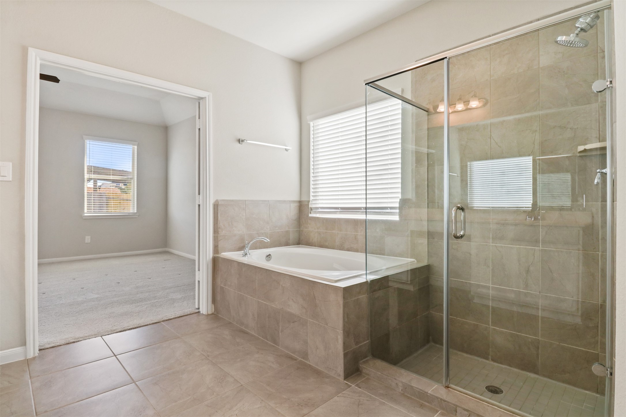 6010 Mapleton Meadow Lane Richmond, TX 77407 - Photo 20 of 34 a spacious bathroom with a shower a bathtub and a sink