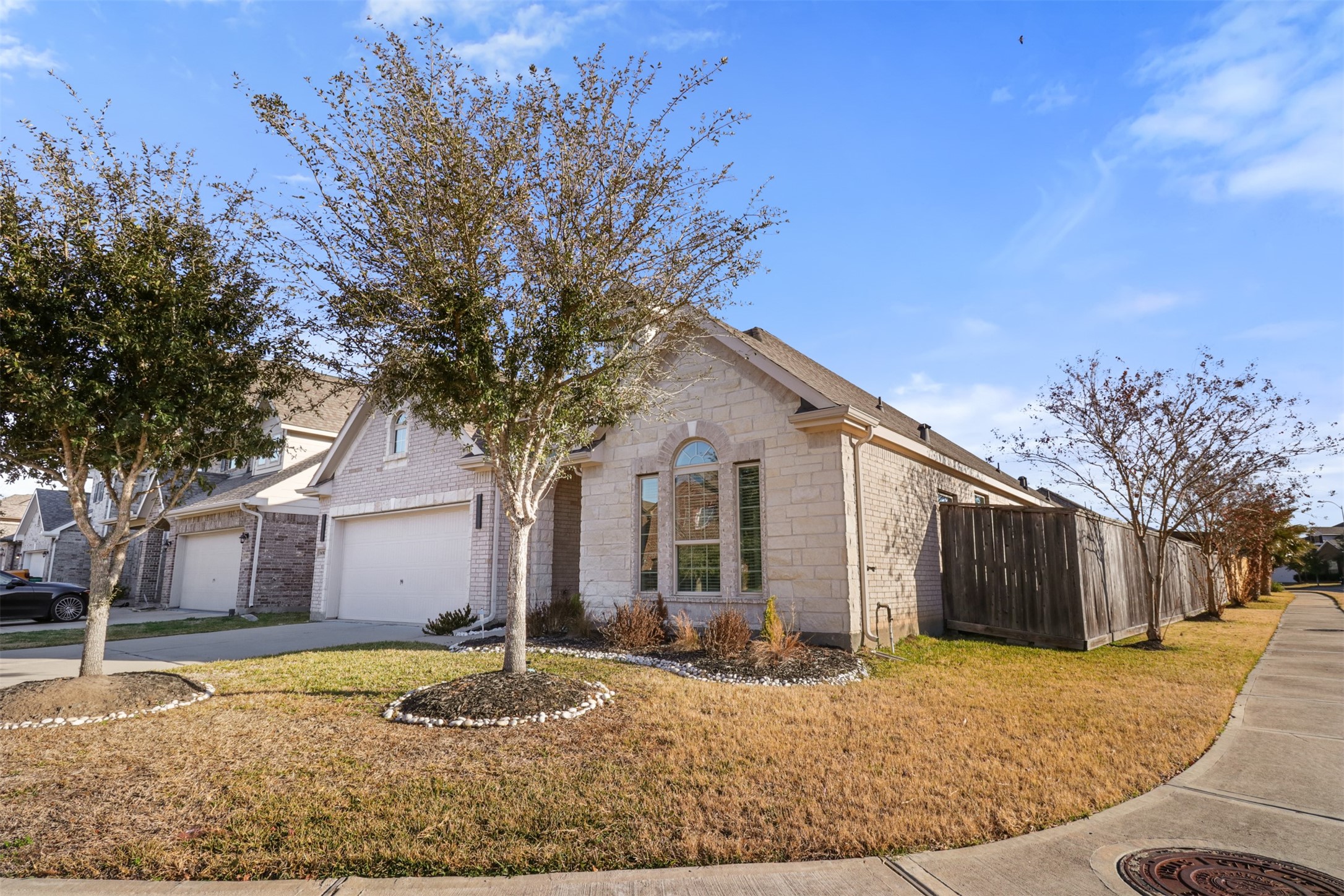 6010 Mapleton Meadow Lane Richmond, TX 77407 - Photo 2 of 34 a front view of a house with a yard