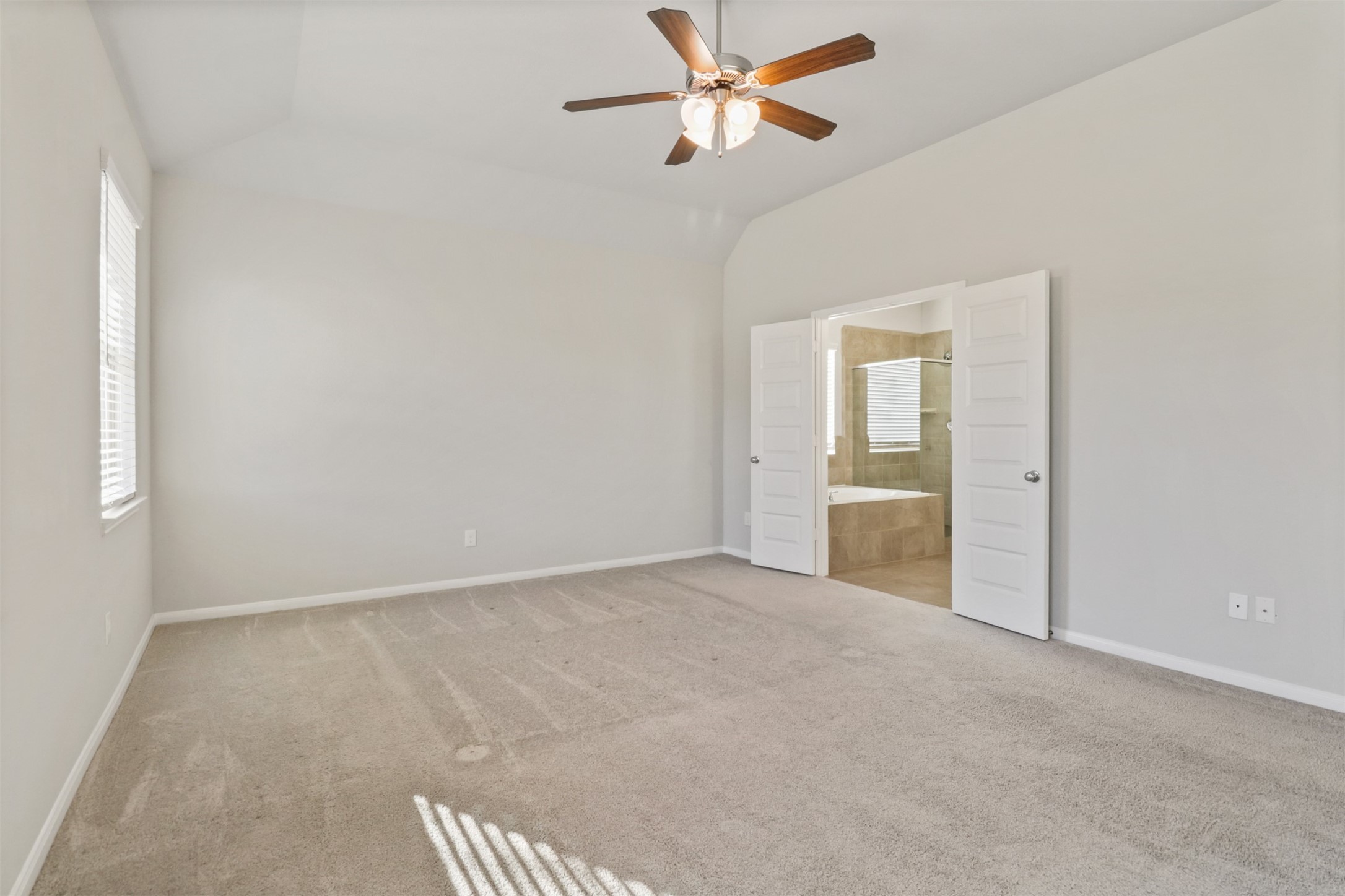 6010 Mapleton Meadow Lane Richmond, TX 77407 - Photo 22 of 34 a view of an empty room and a ceiling fan