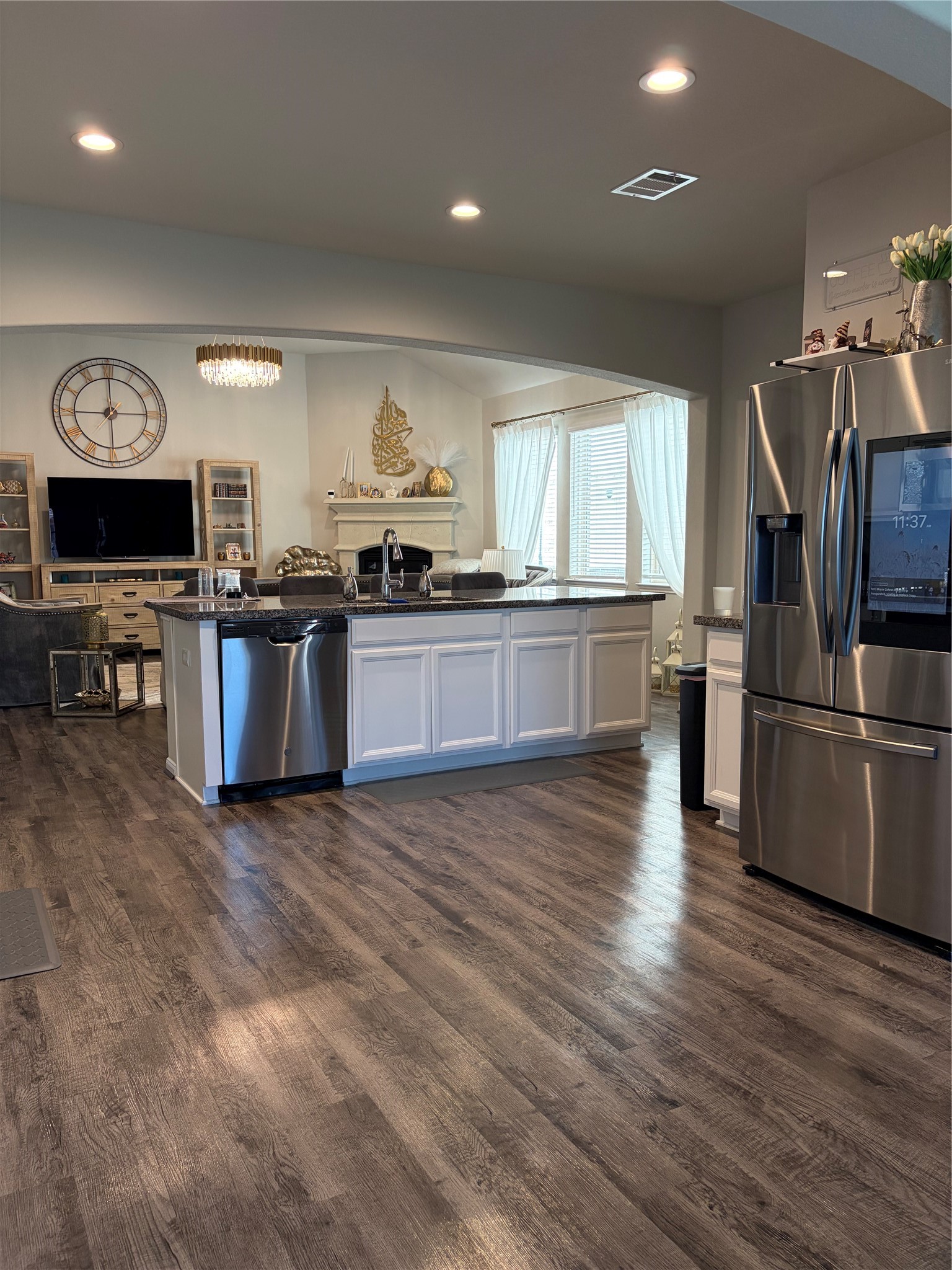 6010 Mapleton Meadow Lane Richmond, TX 77407 - Photo 27 of 34 a kitchen with stainless steel appliances granite countertop a stove and a refrigerator