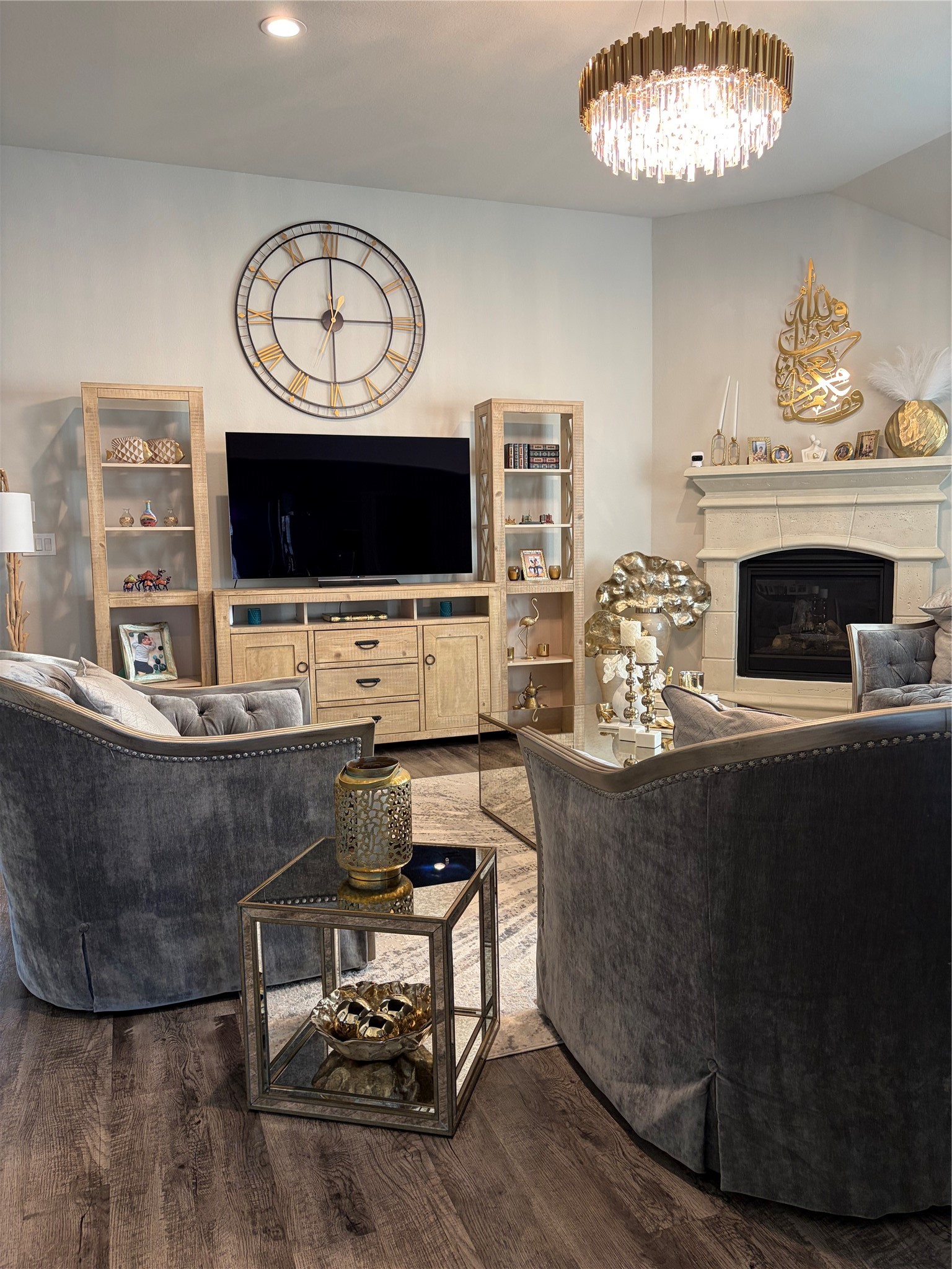 6010 Mapleton Meadow Lane Richmond, TX 77407 - Photo 30 of 34 a living room with furniture a fireplace and a flat screen tv