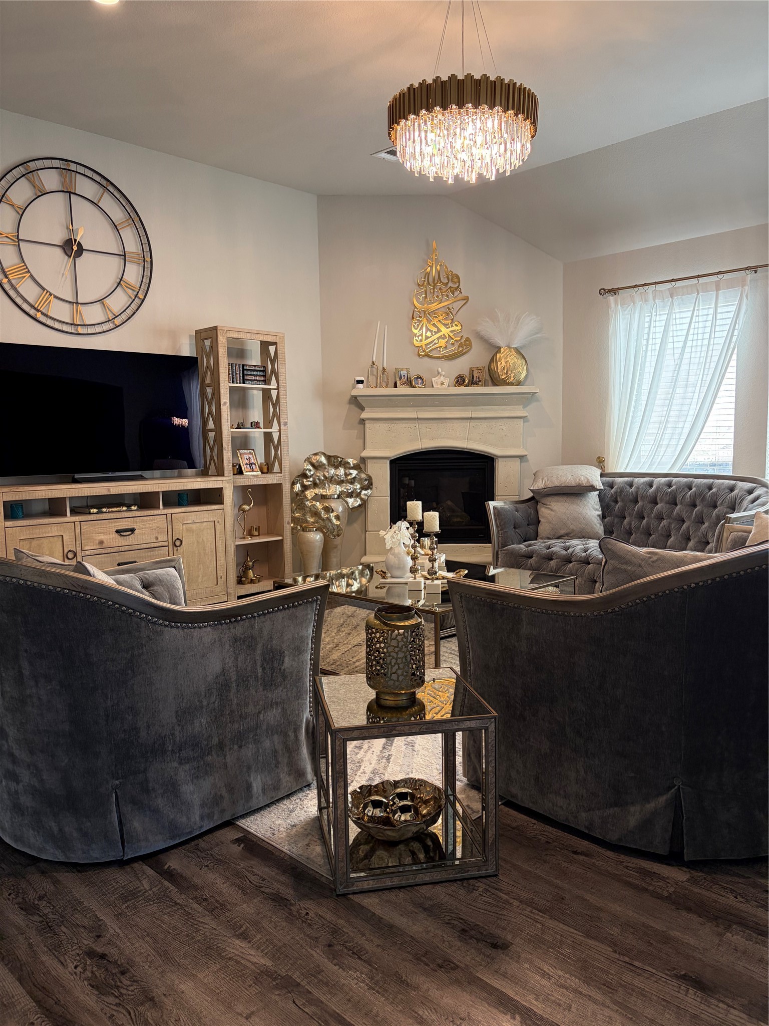 6010 Mapleton Meadow Lane Richmond, TX 77407 - Photo 31 of 34 a living room with furniture a fireplace and a flat screen tv