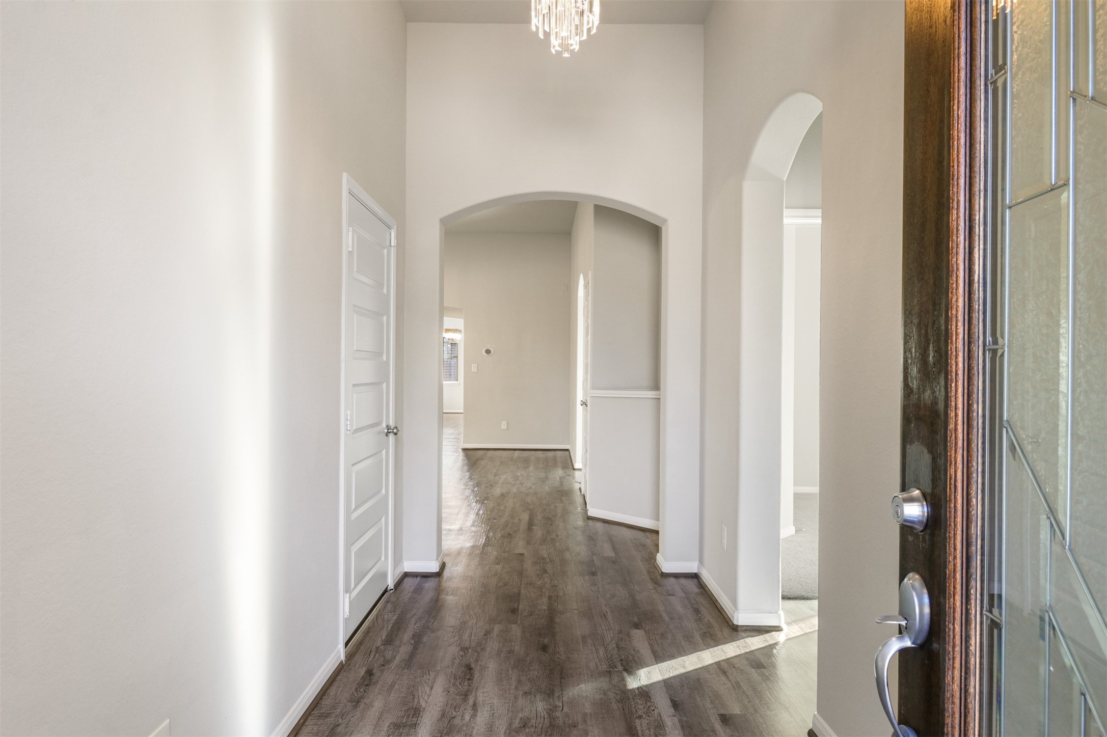 6010 Mapleton Meadow Lane Richmond, TX 77407 - Photo 5 of 34 a view of a hallway with wooden floor and staircase