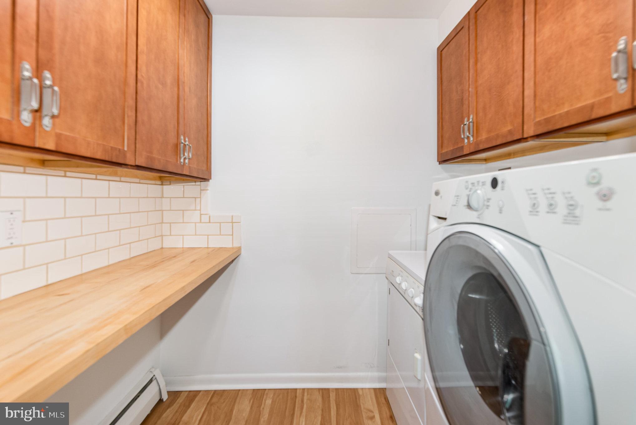939 Starbit Road Towson, MD 21286 - Photo 18 of 52 a view of a kitchen with washer and dryer