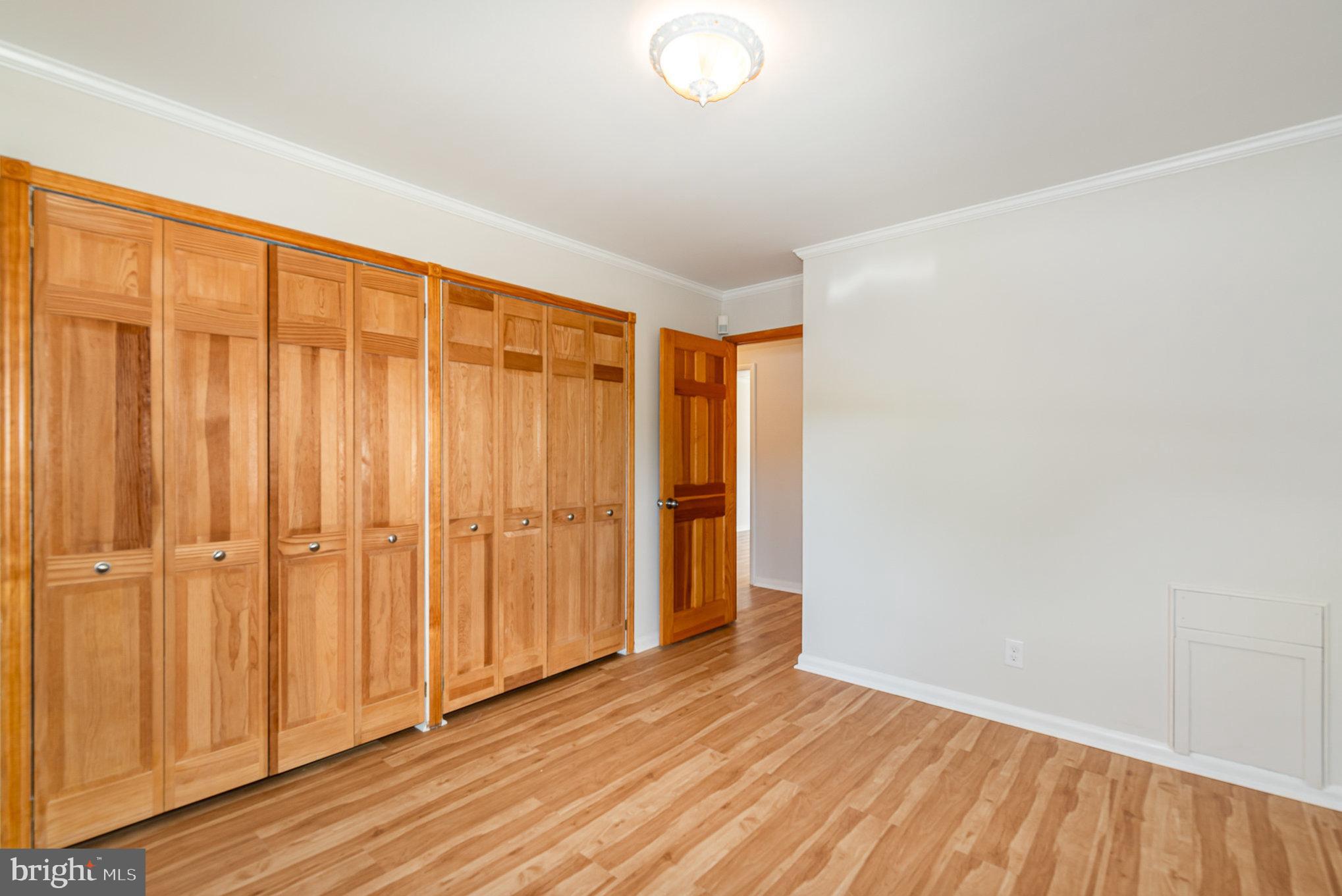 939 Starbit Road Towson, MD 21286 - Photo 28 of 52 a view of an empty room with wooden floor