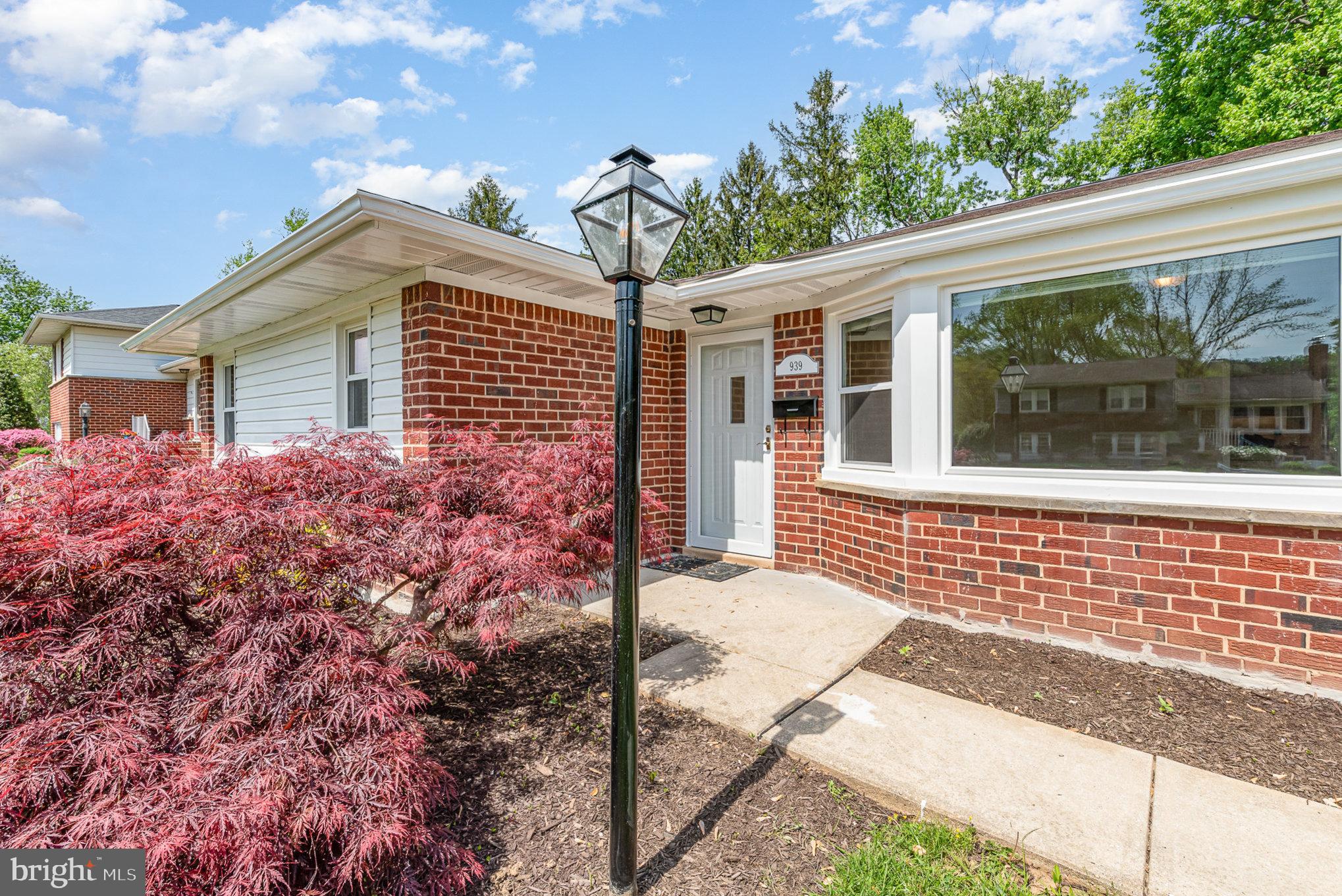 939 Starbit Road Towson, MD 21286 - Photo 37 of 52 a front view of a house with garden