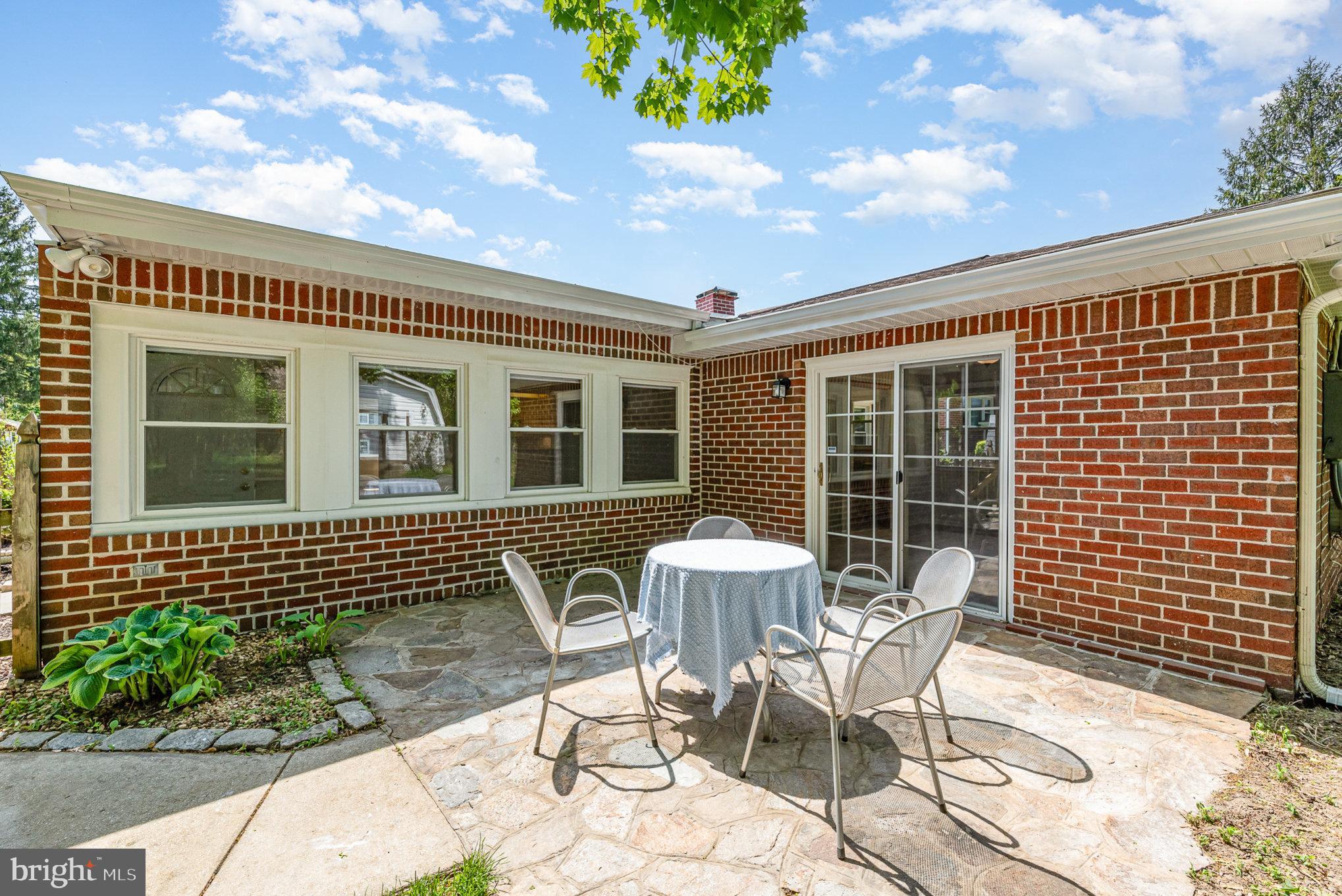 939 Starbit Road Towson, MD 21286 - Photo 40 of 52 a view of a house with backyard and sitting area