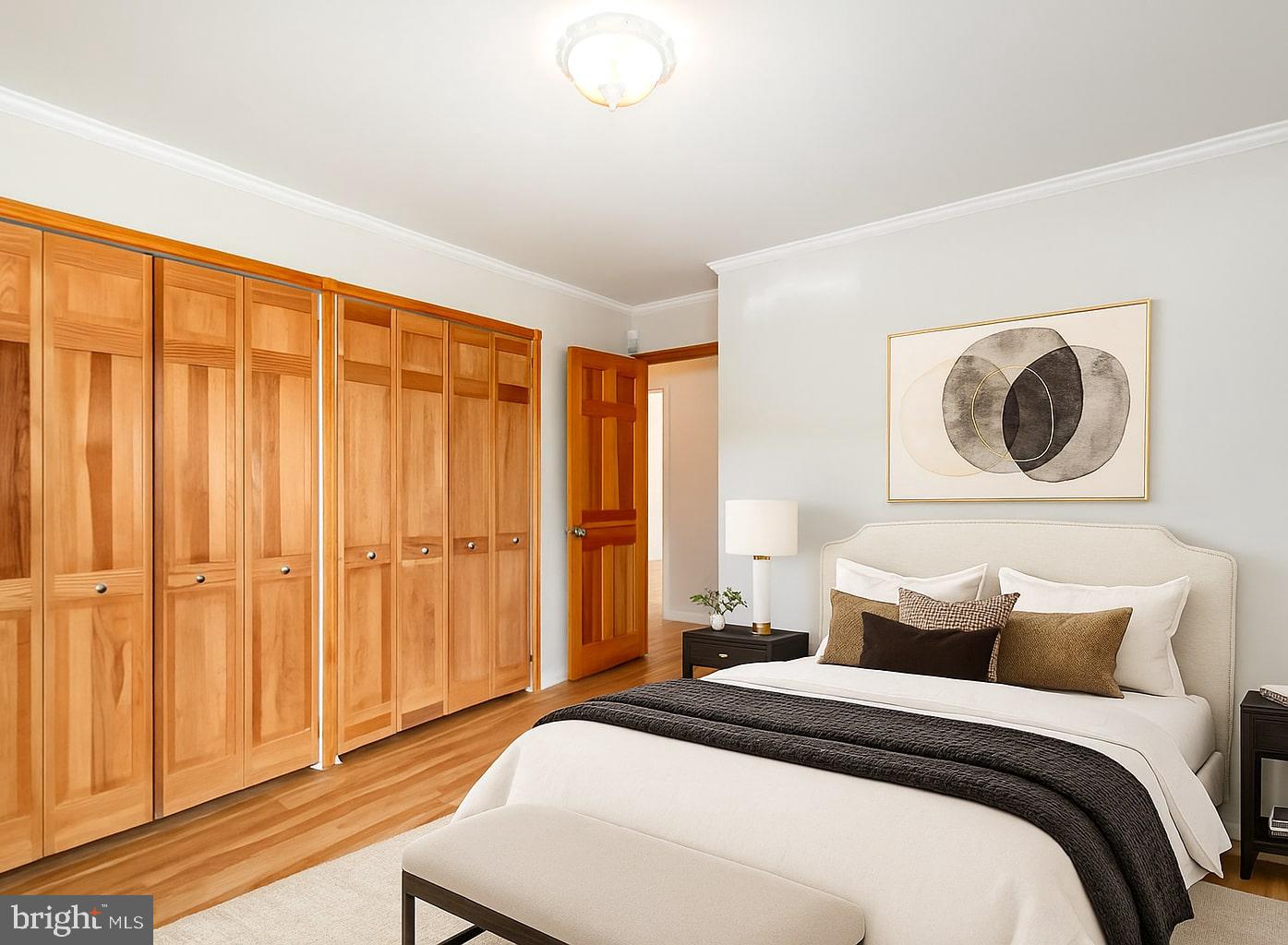 939 Starbit Road Towson, MD 21286 - Photo 47 of 52 a bedroom with a bed and a painting on the wall