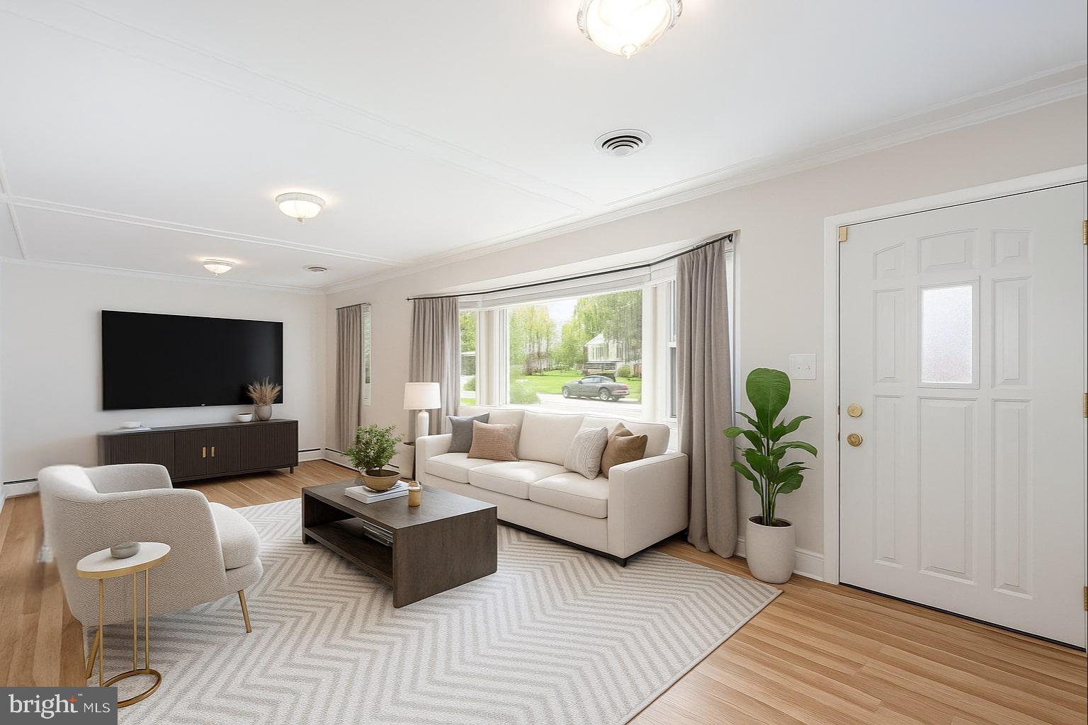 939 Starbit Road Towson, MD 21286 - Photo 52 of 52 a living room with furniture and a flat screen tv