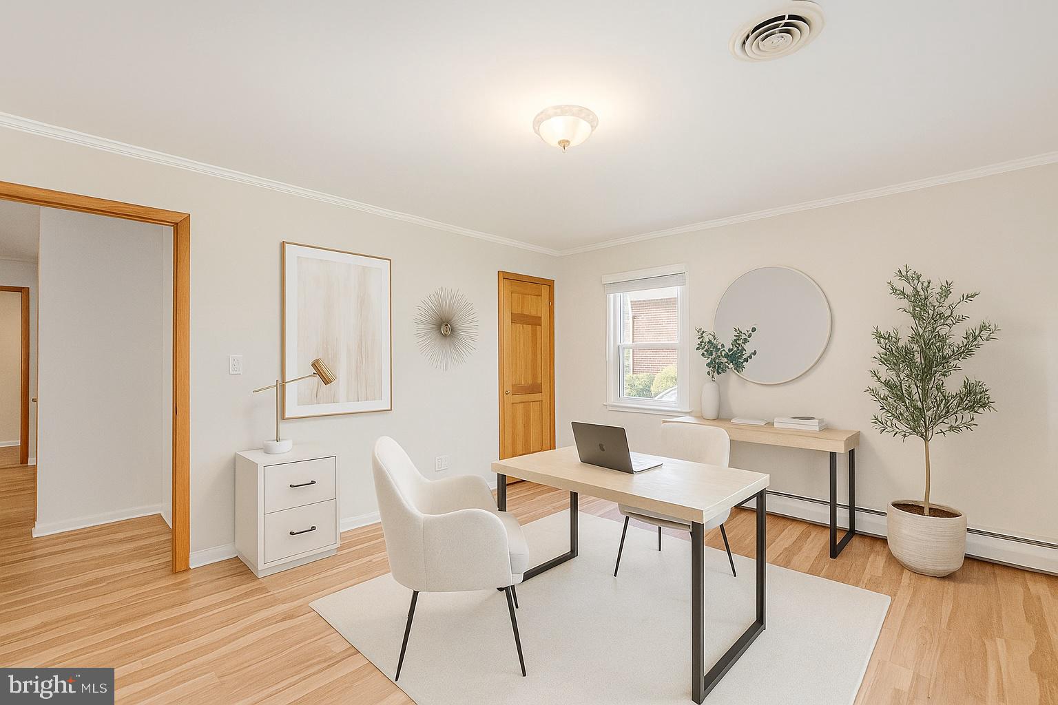 939 Starbit Road Towson, MD 21286 - Photo 6 of 52 a living room with furniture a window and wooden floor