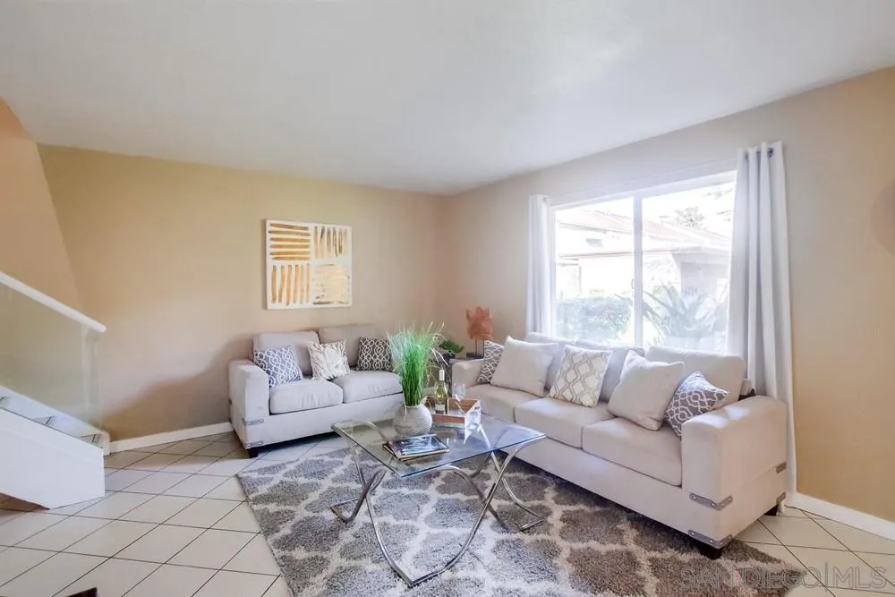 933 Greenfield Drive, Unit D El Cajon, CA 92021 - Photo 13 of 41 a living room with furniture and a large window
