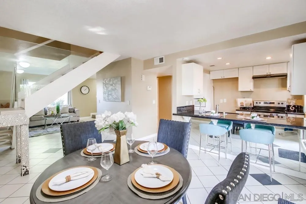 933 Greenfield Drive, Unit D El Cajon, CA 92021 - Photo 14 of 41 a dining room with furniture and a wooden floor