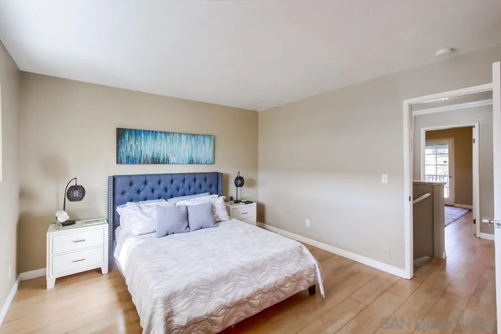 933 Greenfield Drive, Unit D El Cajon, CA 92021 - Photo 21 of 41 a bedroom with a bed and a view