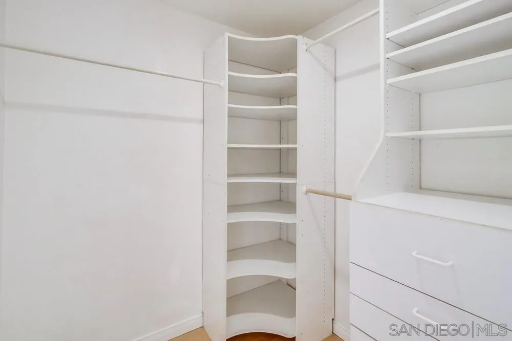 933 Greenfield Drive, Unit D El Cajon, CA 92021 - Photo 22 of 41 a view of walk in closet with empty racks