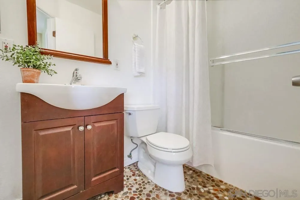 933 Greenfield Drive, Unit D El Cajon, CA 92021 - Photo 23 of 41 a bathroom with a sink toilet and shower