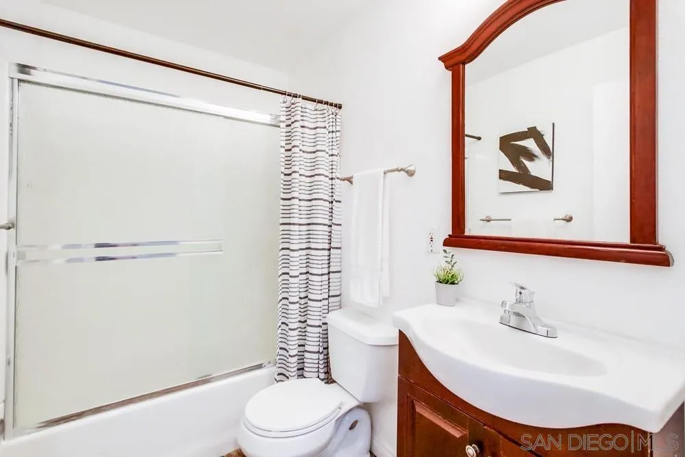 933 Greenfield Drive, Unit D El Cajon, CA 92021 - Photo 24 of 41 a bathroom with a sink a toilet and shower