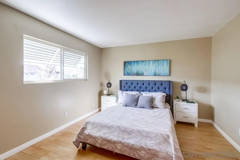 933 Greenfield Drive, Unit D El Cajon, CA 92021 - Photo 25 of 41 a bedroom with a bed and a window