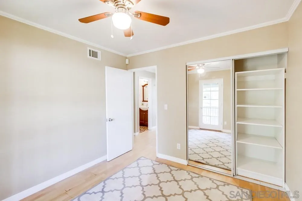 933 Greenfield Drive, Unit D El Cajon, CA 92021 - Photo 27 of 41 a view of an empty room and window with a ceiling fan