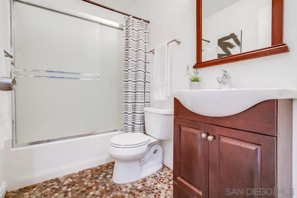 933 Greenfield Drive, Unit D El Cajon, CA 92021 - Photo 29 of 41 a bathroom with a sink toilet and shower