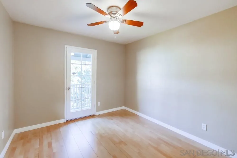 933 Greenfield Drive, Unit D El Cajon, CA 92021 - Photo 30 of 41 an empty room with windows and fan
