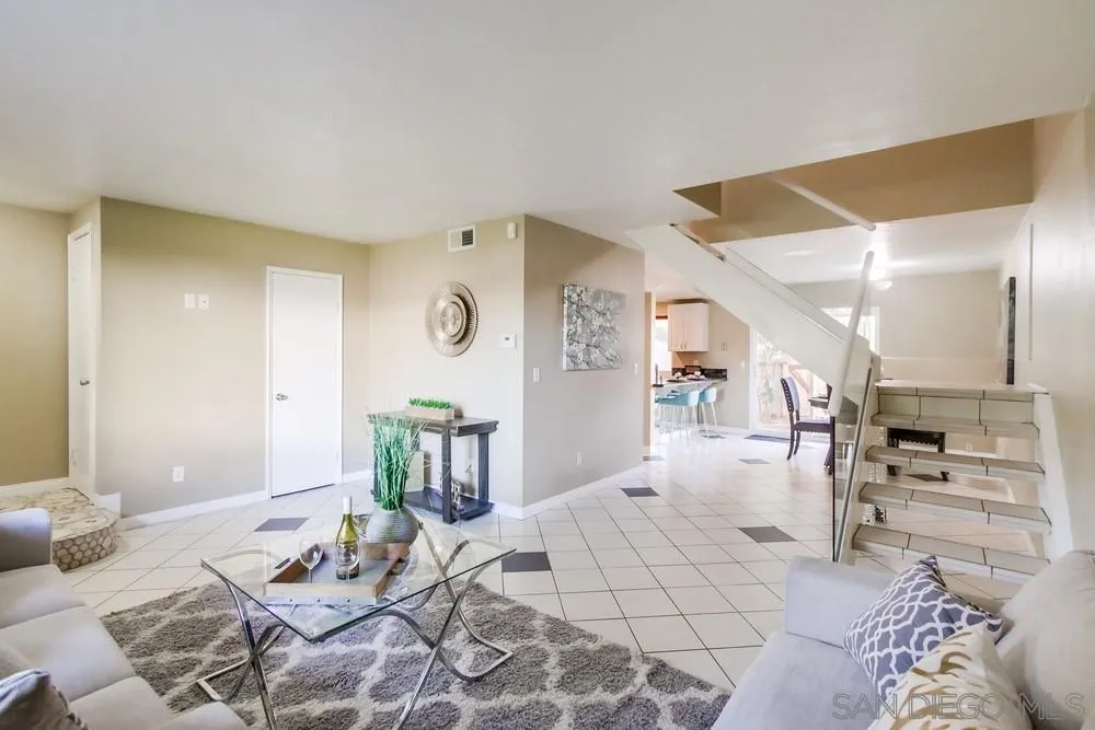 933 Greenfield Drive, Unit D El Cajon, CA 92021 - Photo 4 of 41 a living room with furniture and view of kitchen