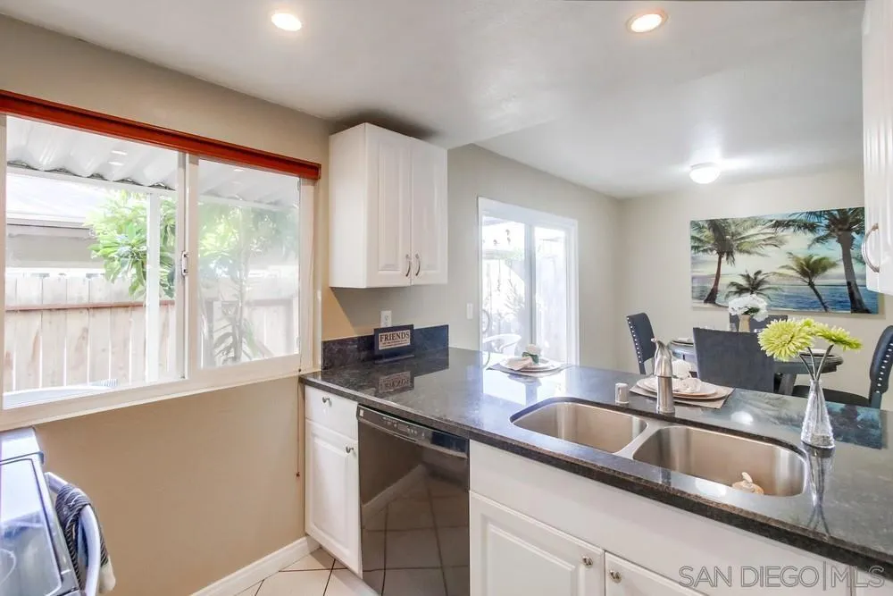 933 Greenfield Drive, Unit D El Cajon, CA 92021 - Photo 7 of 41 a kitchen with granite countertop a sink and a counter top space