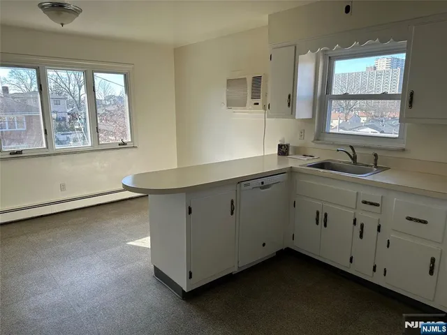 a utility room with cabinets
