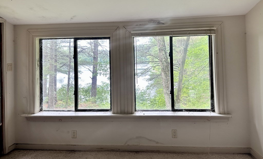 9 Washburn Terrace Spencer, MA 01562 - Photo 6 of 11 a living room with a large window and front door