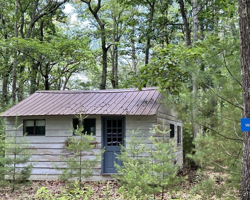 9 Washburn Terrace Spencer, MA 01562 - Photo 8 of 11 a front view of a house with garden