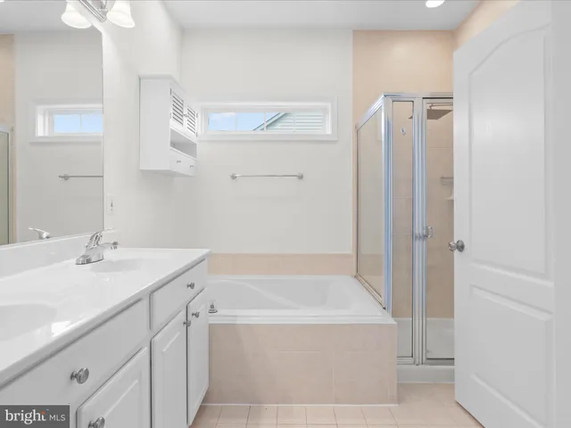 a bathroom with a bathtub and a sink