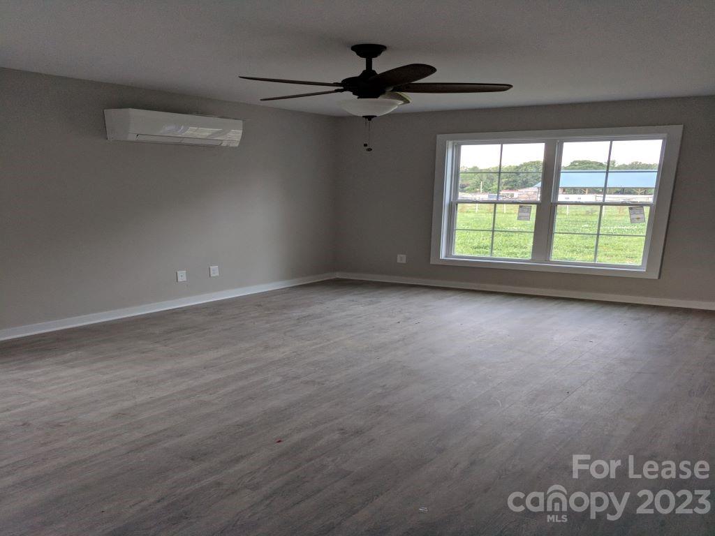 740 Happy Lake Road Salisbury, NC 28146 - Photo 3 of 5 an empty room with a window