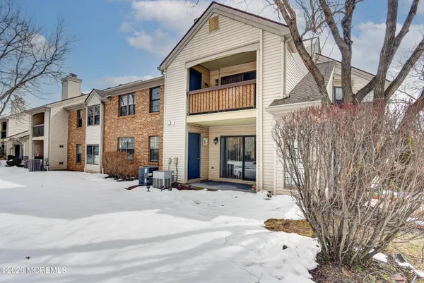 a view of a building with a yard