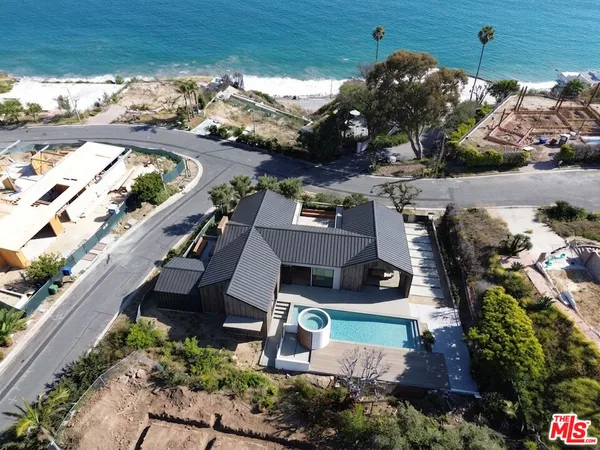 an aerial view of a house with a garden