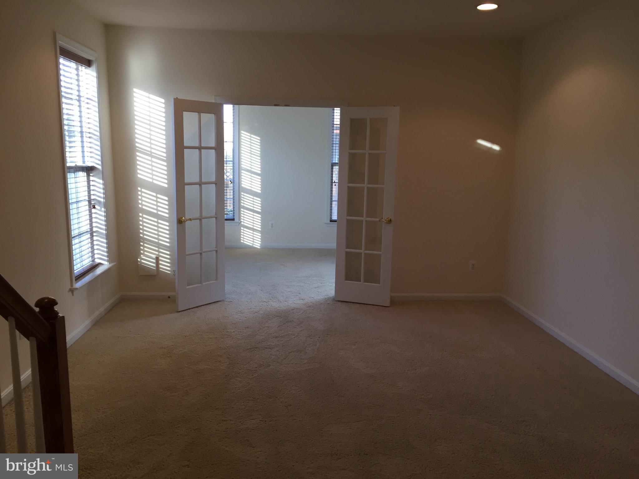 25153 Cutgrass Terrace Stone Ridge, VA 20105 - Photo 20 of 24 Lower level rec room leads to siider to rear yard