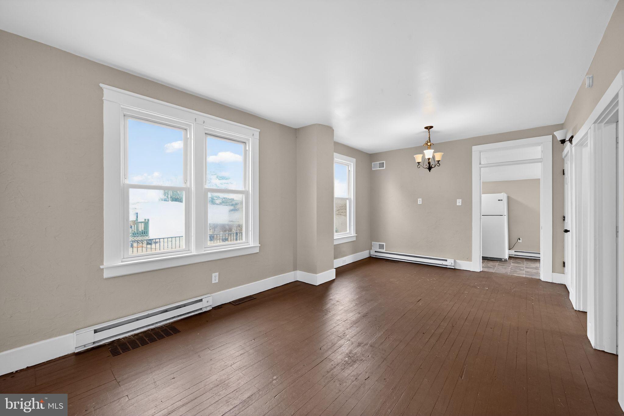 38 North Scott Street York, PA 17404 - Photo 15 of 16 an empty room with wooden floor and windows