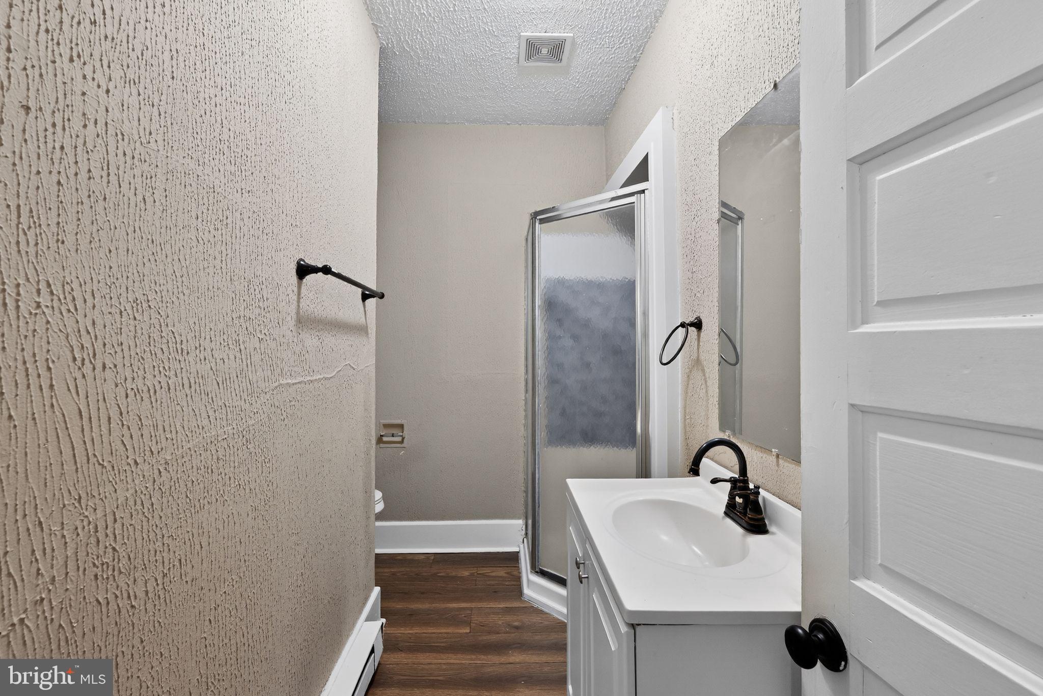 38 North Scott Street York, PA 17404 - Photo 16 of 16 a bathroom with a sink and mirror