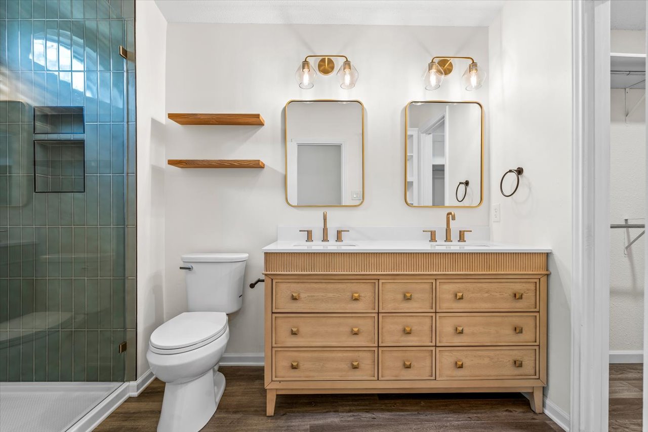 4004 Danli Lane Austin, TX 78749 - Photo 34 of 40 a bathroom with a toilet a sink and mirror