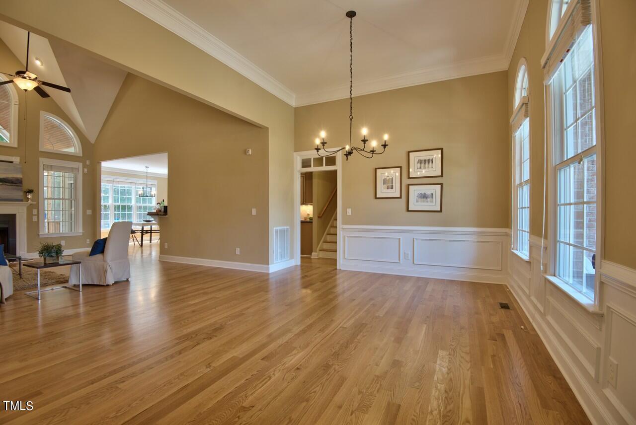 2919 Reynolda Circle Durham, NC 27712 - Photo 13 of 58 a view of a livingroom with furniture wooden floor chandelier and windows