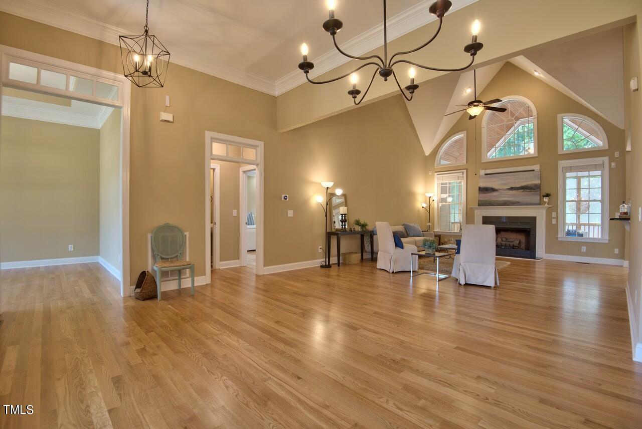 2919 Reynolda Circle Durham, NC 27712 - Photo 17 of 58 a view of a livingroom with furniture a fireplace and wooden floor