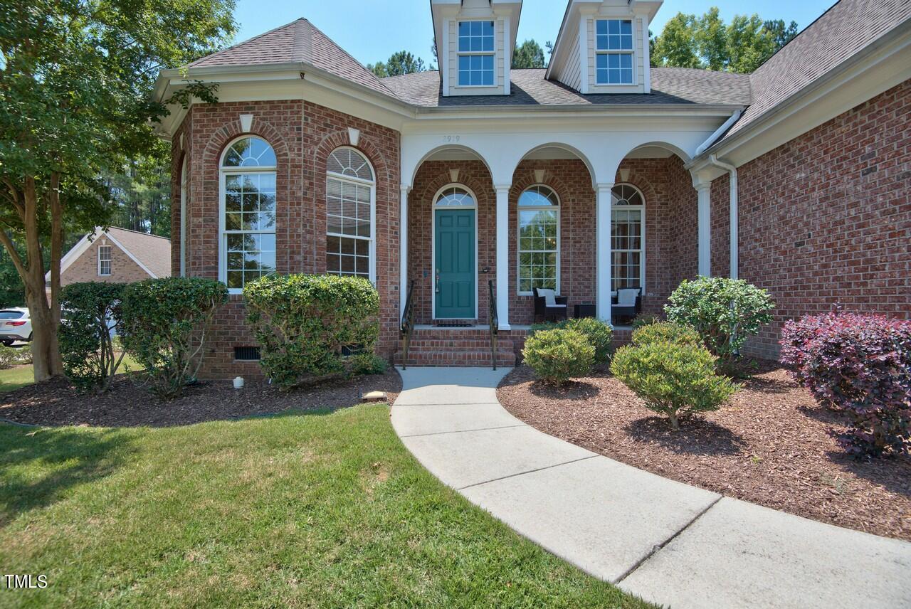 2919 Reynolda Circle Durham, NC 27712 - Photo 3 of 58 a front view of a house with garden