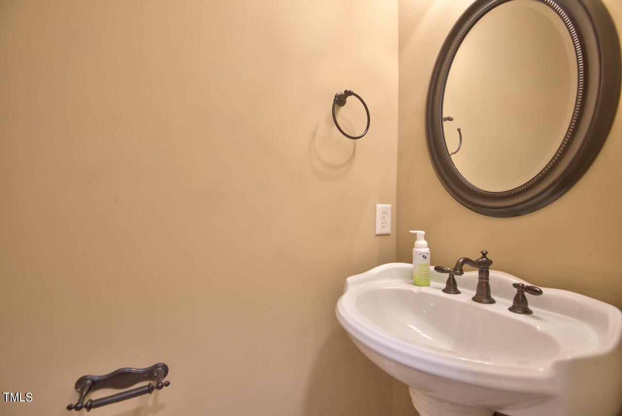 2919 Reynolda Circle Durham, NC 27712 - Photo 37 of 58 a bathroom with a sink and a mirror