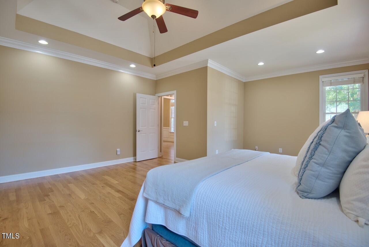 2919 Reynolda Circle Durham, NC 27712 - Photo 40 of 58 a bed room with a bed and a ceiling fan