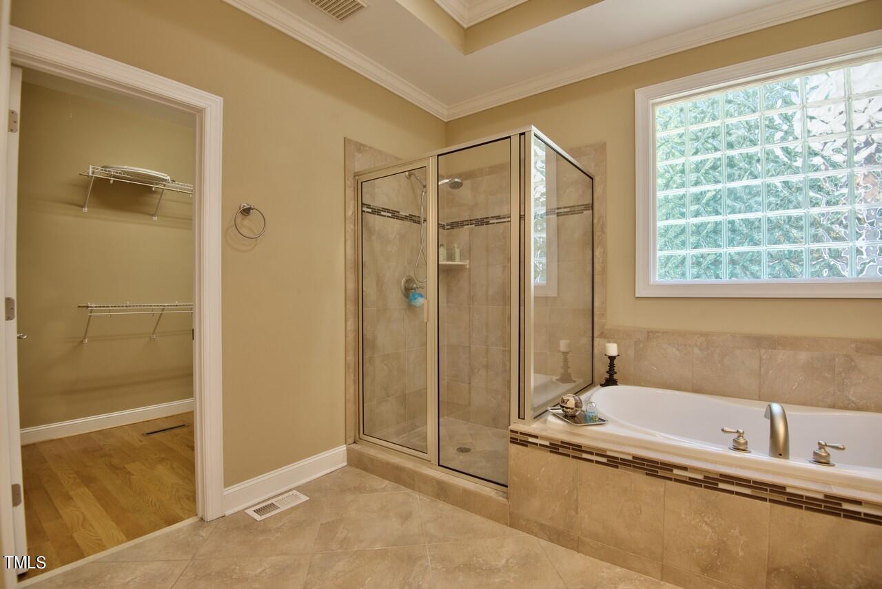 2919 Reynolda Circle Durham, NC 27712 - Photo 43 of 58 a bathroom with a tub and shower